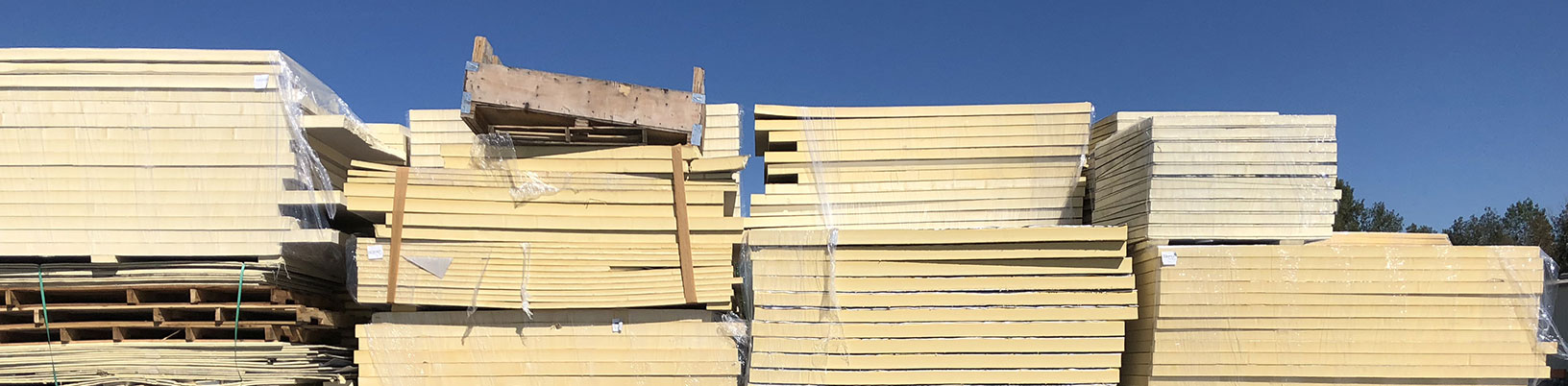 Stacks of used foam insulation boards ready for reuse